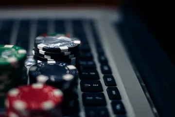 A cheerful woman in traditional clothing using her smartphone during a festive moment, showing how easily the 7C777 app fits into everyday life.