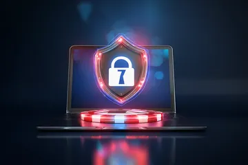 A laptop glowing with a bright login prompt in a minimalistic setup, symbolizing the protected access system at 7C777.